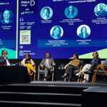 AMIG Brasil media debate sobre  planos estaduais de mineração e desenvolvimento regional durante a Exposibram
